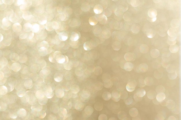 abstract golden bokeh background, defocused blurry sparkles.