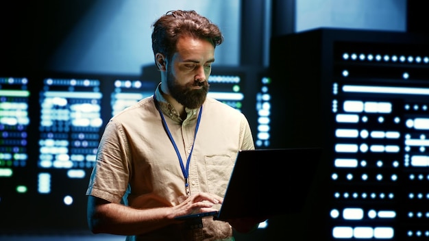 Admin reconfiguring server farm to optimize it for data processing requirements of artificial intelligence workloads Expert checking neural network data center used for machine learning