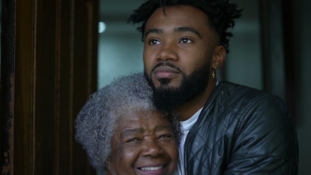 adult grandson embracing senior grandmother authentic and real life