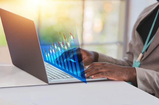 African american businessman using computer trading online stock market
