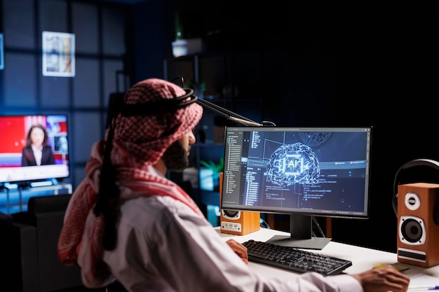 An Arabian engineer examining data and ensuring cybersecurity With expertise in information technology and programming he develops software for machine learning and quantum computing