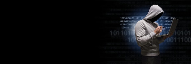 Anonymous hacker with computer code binary interface