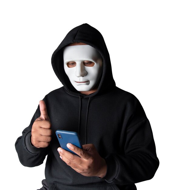 Anonymous masked hacker is using smartphones to penetrate financial data with clipping path hacking and malware concept