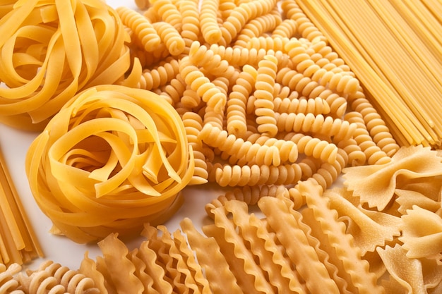 assorted varieties of pasta background. mix macaroni