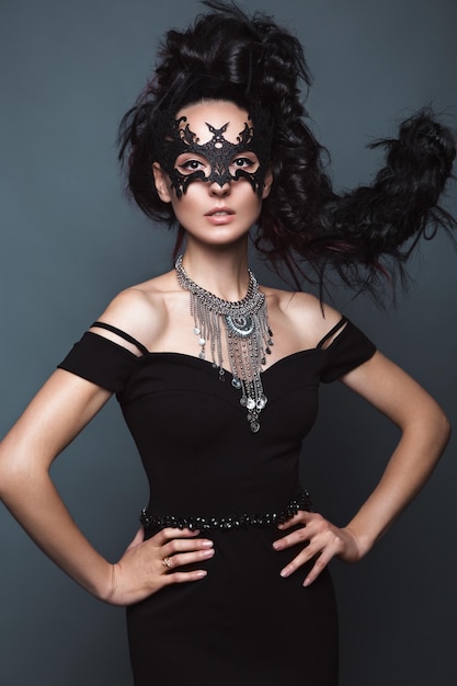 beautiful girl in evening dress with avantgarde hairstyles beauty the face