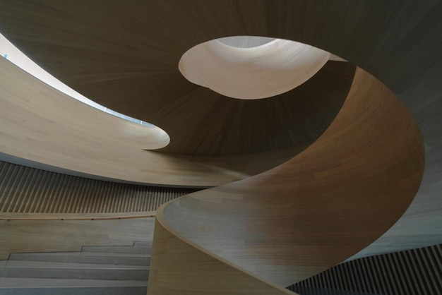 beautiful shot of a modern futuristic wooden oval staircase