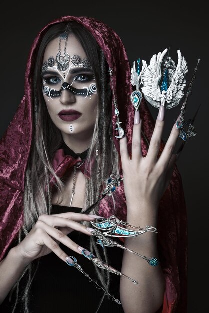 beautiful woman with art makeup creative long nails design manicure beauty face
