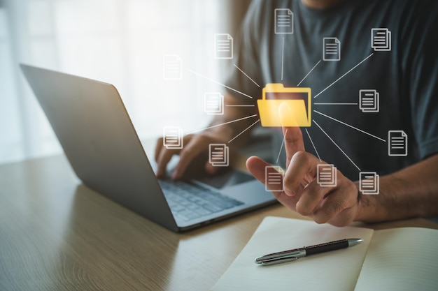 Big data clouds computing database document management system concept business man using finger point folder and document icon software network searching and manage files online document database