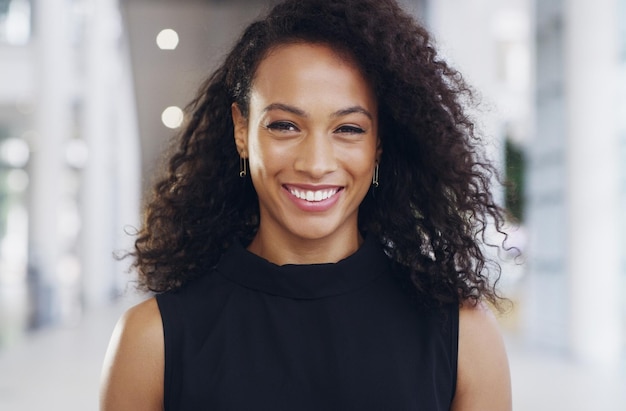 black woman portrait and smile in office for career with finance employee with confidence for accounting female accountant happy or workplace building with pride for professional job in corporate