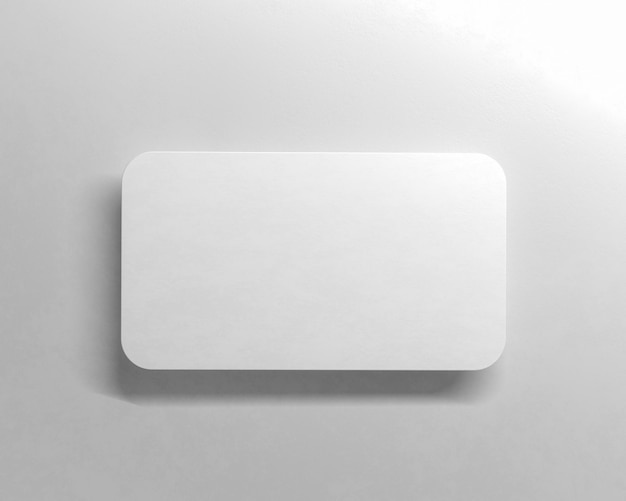 Blank white business card on gray background