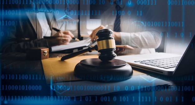 business and lawyers discussing contract papers with brass scale on desk in office law legal services advice justice and law concept picture with film grain effect