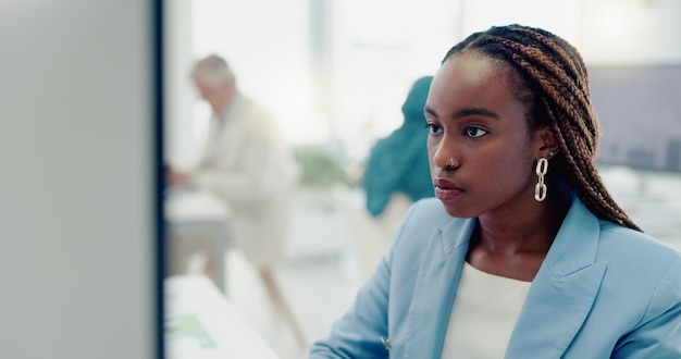Business computer and working black woman in office reading typing and review online marketing strategy Research technology and female employee with focus concentration and busy with project