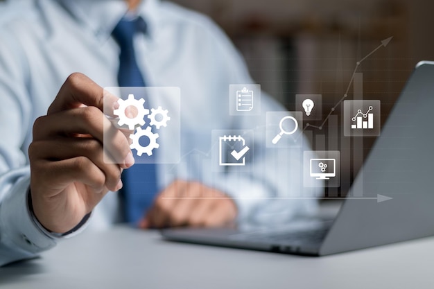 Business management concept businessman analyzing business process and planning business investment growth graph automated workflow