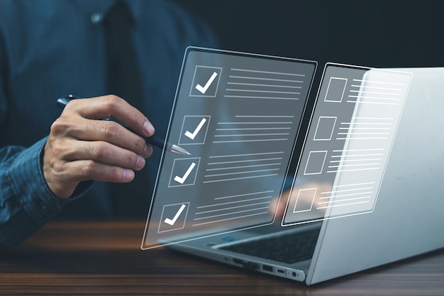 businessman check box on quality document control checklist and business approve project concept