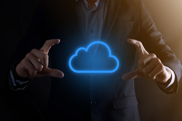 Businessman hand holding cloud computing concept in palm.