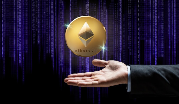 businessman hand with ethereum over binary code