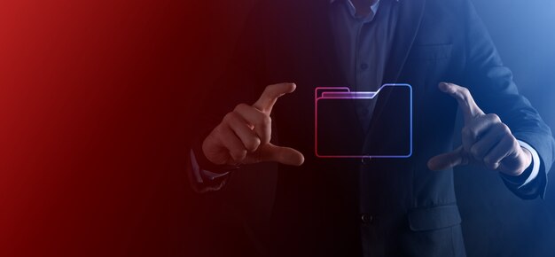 Businessman hold folder icon.Document Management System or DMS setup by IT consultant with modern computer are searching managing information and corporate files.Business processing.