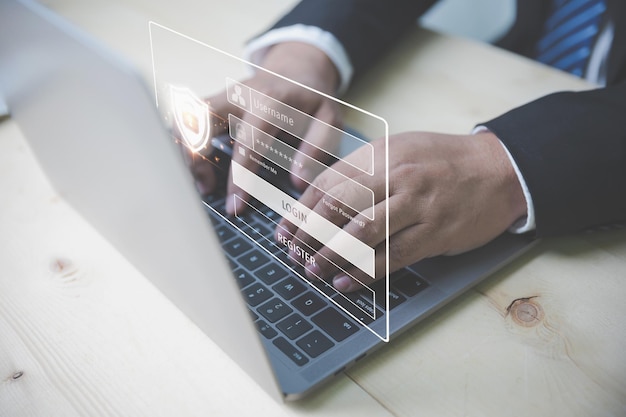 Businessman input password login uses a laptop computer Preventing identity cybersecurity from online internet hackers Login to access personal information Secure Internet access cybersecurity