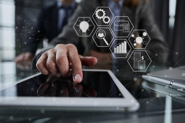 businessman pressing his finger on the screen of the digital tab