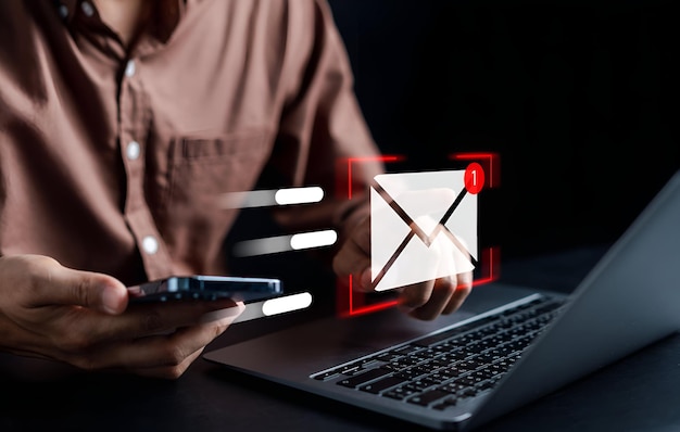 Businessman sending email by laptop computer to customer business contact and communication email icon email marketing concept