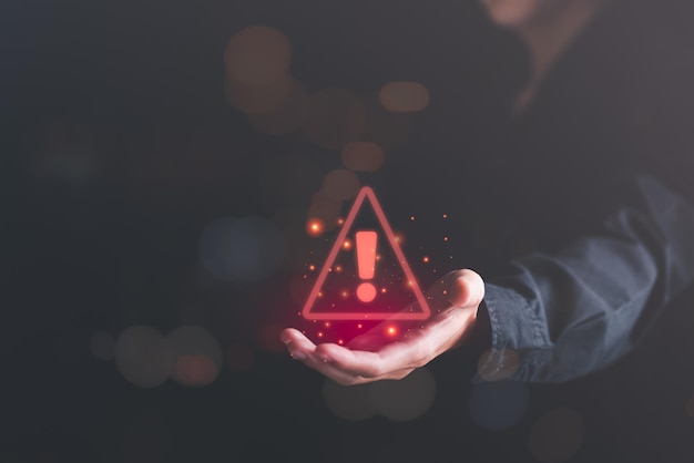 businessman showing warning icon exclamation markalarmcomputer virus d