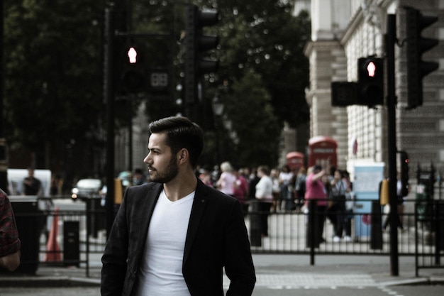 businessman standing on street in city