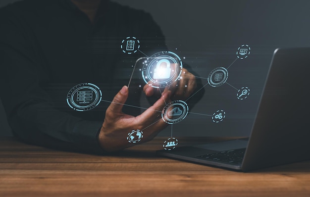 Businessman touching to sign in for protecting personal data with virtual screen interfaces login icon and internet network security technology Cybersecurity and privacy concepts to protect data