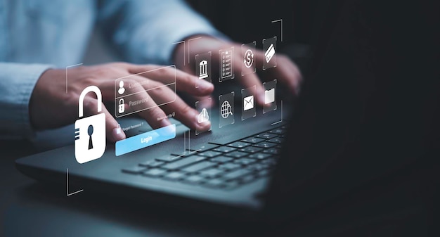 Businessman typing on keyboard laptop computer to input username and password for technology security system and prevent hacker concept