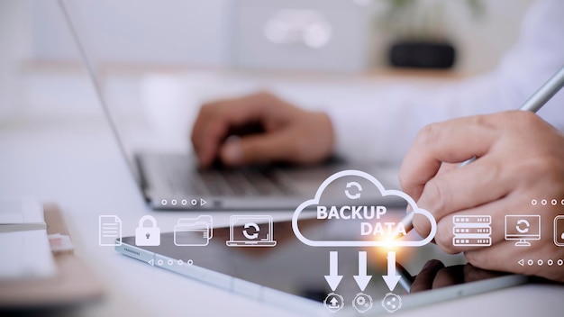 businessman using a computer to backup storage data internet technology concept for backup online documentation database and digital file storage system or softwarefile access doc sharing