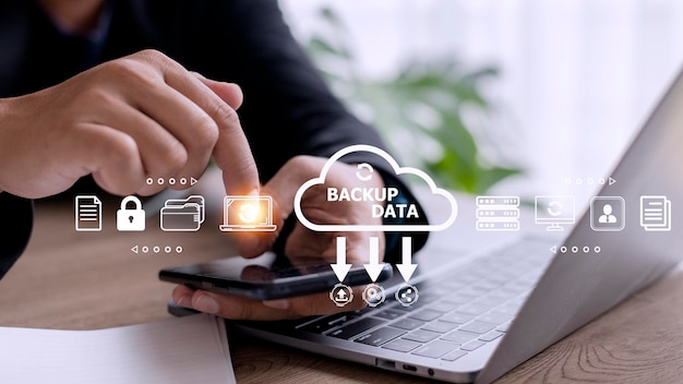businessman using a computer to backup storage data internet technology concept for backup online documentation database and digital file storage system or softwarefile access doc sharing