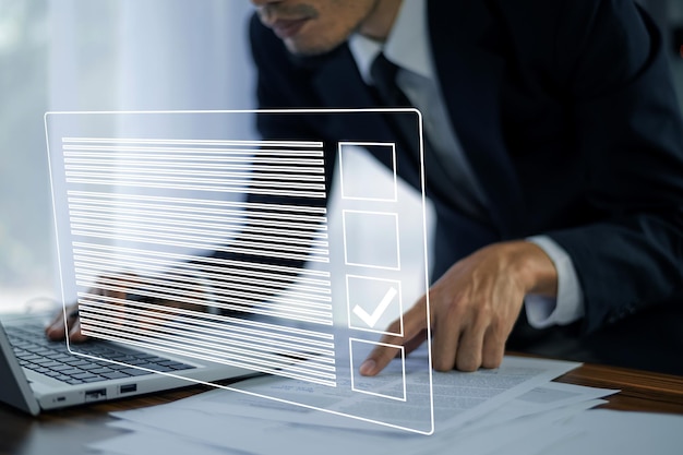 Businessman using Electronic smart checklist and document on virtual screens concept business people check electronic documents on digital documents paperless offices