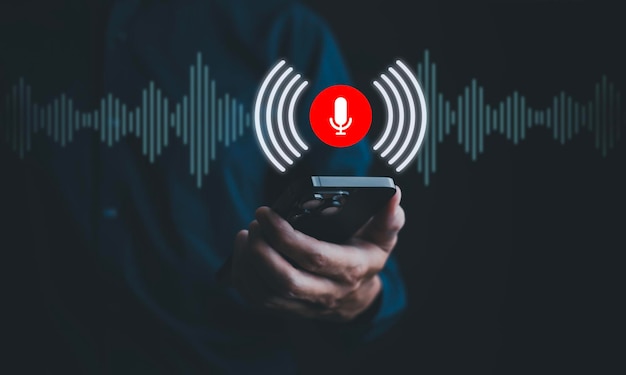 Businessman using mobile and touch microphone button on virtual screen Blog blog speak talk advertising presentationVoice recognition speech detection and deep learning applicationVoice Assistance