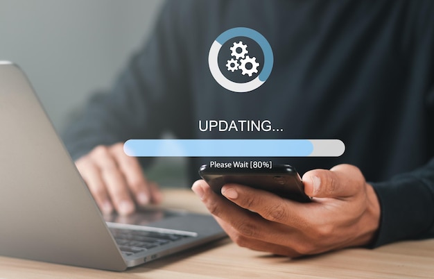 businessman working and installing update process software updates or operating system upgrades to keep your device up to date with enhanced functionality in new versions and improved security