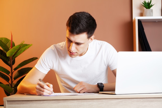 Businessman working in the office at laptop