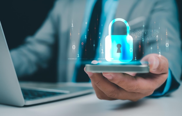 businessman working on phone and computer online showing protection icons cyber espionage