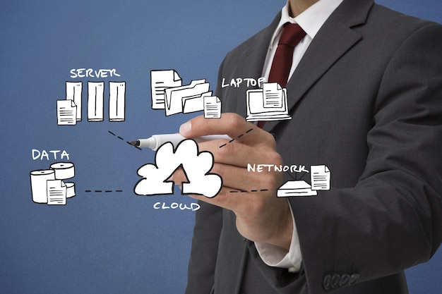 Businessman writing doodle against blue background with vignette