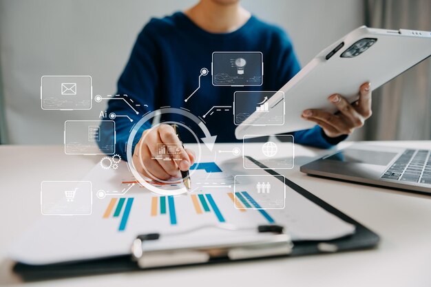 Businesswoman hand working digital marketing media in virtual screen with mobile phone and modern compute with VR icon diagram at officexA