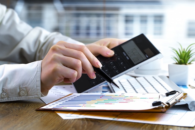 Businesswoman works with items for doing business in the office.