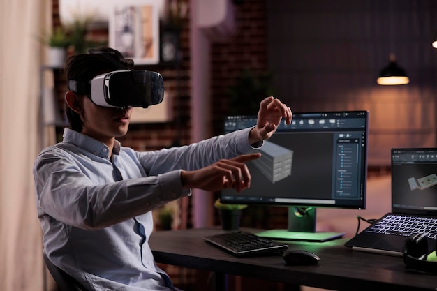 Cad engineer manufacturing industrial product using interactive vr goggles and computer. Engineering technical component with 3d software interface to develop science and industry production.