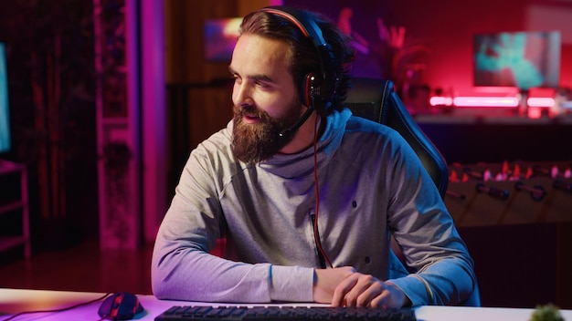 Cheerful gamer unaffected by losing match with teammates while playing esports tournament