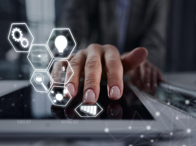 close up businessman pressing his finger on the screen of the digital tablet