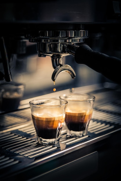 close-up of cup below coffee maker