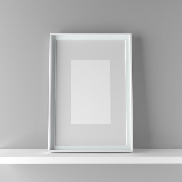 Close-up of empty picture frame on shelf against wall at home