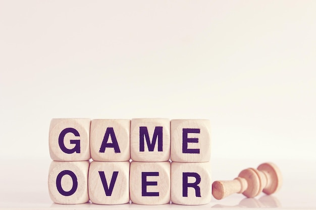 Close-up of game over text on blocks against white background