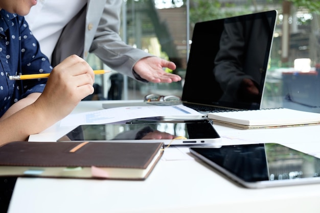 Close-up of people working in office