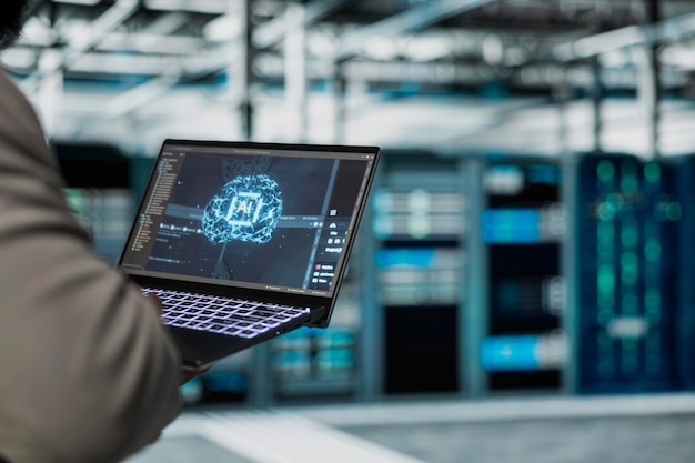Close up of programmer working in data center providing computing resources and storage to enable ai