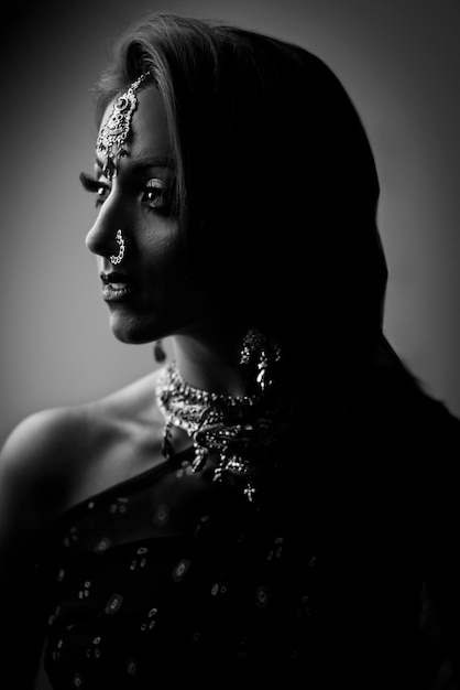 close-up of young woman against gray background