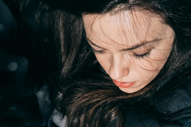 close-up of young woman with black hair