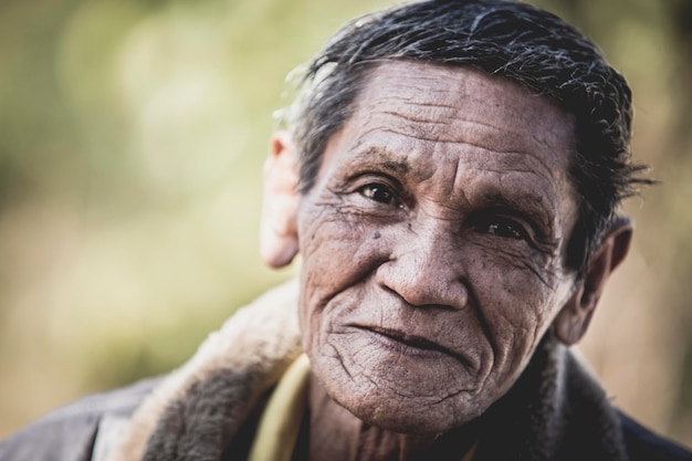 close-up portrait of smiling man outdoors
