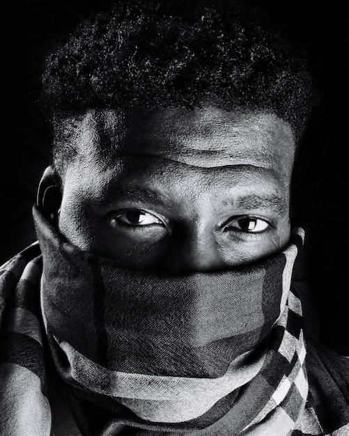 close-up portrait of young man covering face